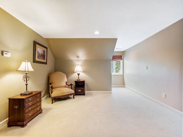 sitting room with light colored carpet