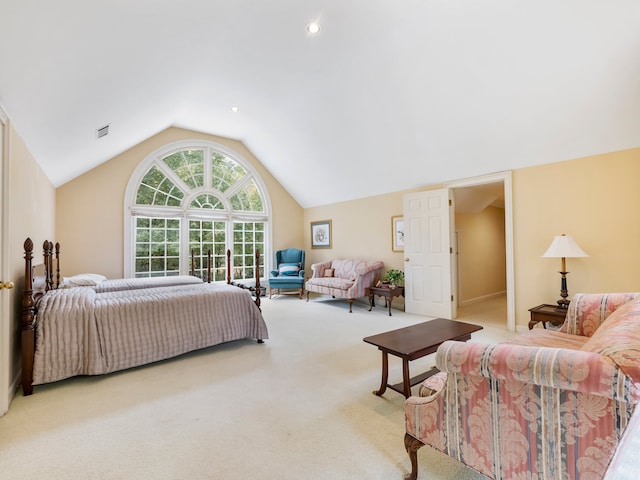 bedroom featuring vaulted ceiling and light colored carpet