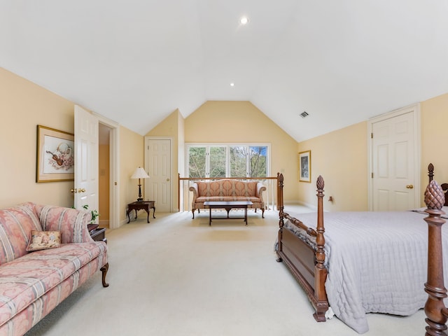 bedroom with lofted ceiling and light colored carpet