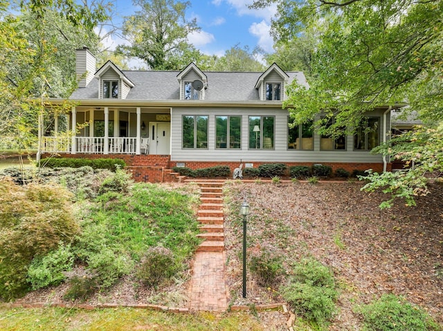 4394 Holly Springs Rd, Pendergrass, GA 30567 - new england style home featuring stairs, a chimney, covered porch, and a sunroom