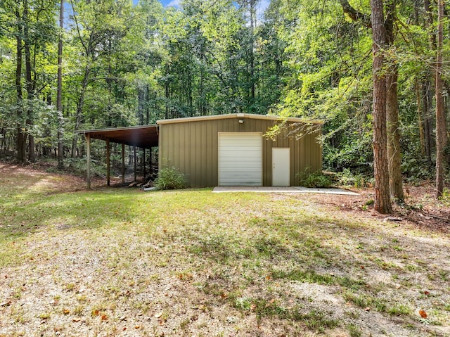 exterior space featuring a lawn and a carport