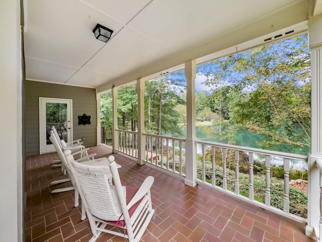 sunroom with a water view