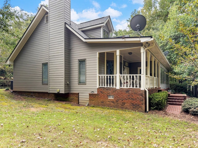 4394 Holly Springs Rd, Pendergrass, GA 30567 - view of side of property with a lawn, covered porch, and a chimney