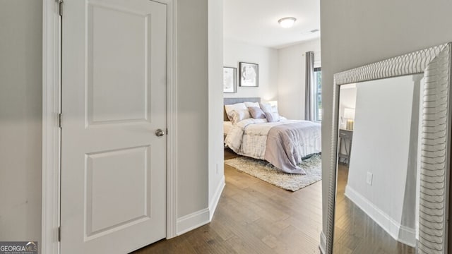 bedroom featuring wood-type flooring