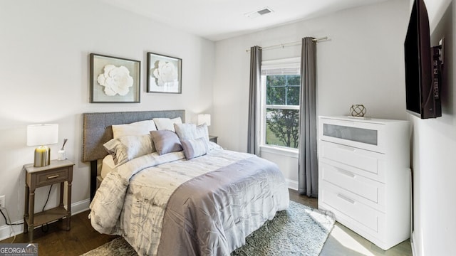 bedroom featuring dark wood-type flooring