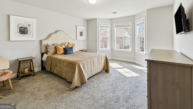 bedroom featuring light colored carpet