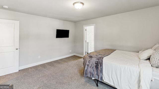 carpeted bedroom featuring a spacious closet