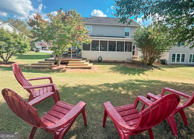 2206 Sugar Maple Ct NW, Acworth, GA 30101 - rear view of property with a sunroom, a yard, a wooden deck, and a chimney