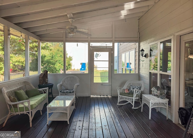 sunroom / solarium featuring lofted ceiling, ceiling fan, and a wealth of natural light