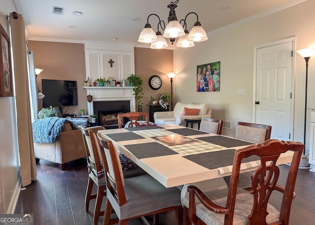2206 Sugar Maple Ct NW, Acworth, GA 30101 - dining room featuring crown molding, a fireplace, dark wood-type flooring, visible vents, and a notable chandelier