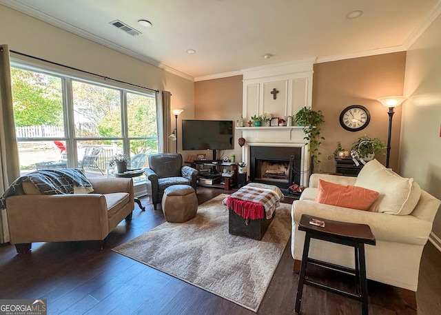 living room with ornamental molding and dark hardwood / wood-style floors