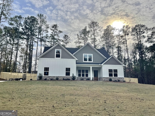 view of front of house with a yard