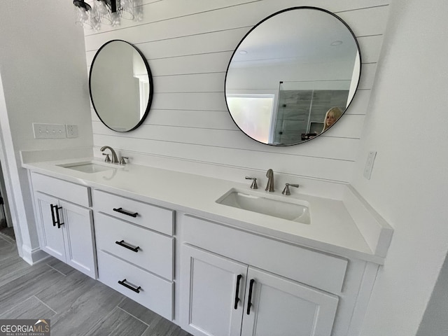 bathroom with vanity and an enclosed shower