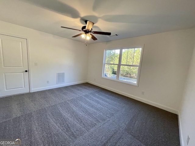 carpeted empty room featuring ceiling fan