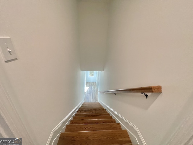 staircase featuring hardwood / wood-style flooring