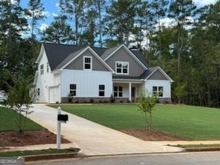 view of front facade featuring a garage and a front lawn