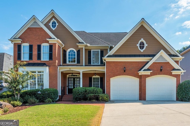 view of front facade with a front yard and a garage