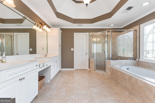 bathroom featuring a tray ceiling, crown molding, vanity, and separate shower and tub