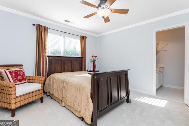 carpeted bedroom featuring ensuite bath, ceiling fan, and crown molding