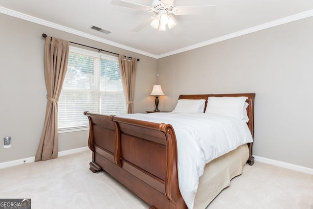 carpeted bedroom featuring multiple windows, ceiling fan, and ornamental molding