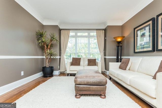 living room with hardwood / wood-style floors and crown molding