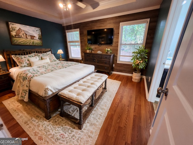 full bathroom featuring toilet, vanity, hardwood / wood-style flooring, and shower / tub combo with curtain