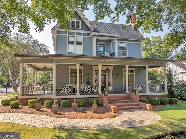 victorian home with ceiling fan and covered porch