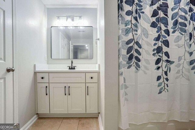 bathroom featuring a shower with curtain, vanity, and tile patterned flooring