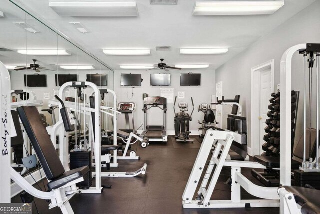 exercise room with ceiling fan