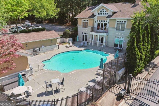 view of swimming pool featuring a patio area