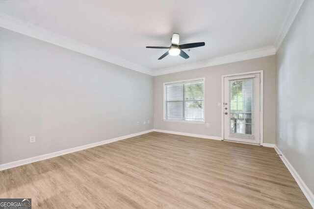 empty room with light hardwood / wood-style flooring, ceiling fan, and ornamental molding