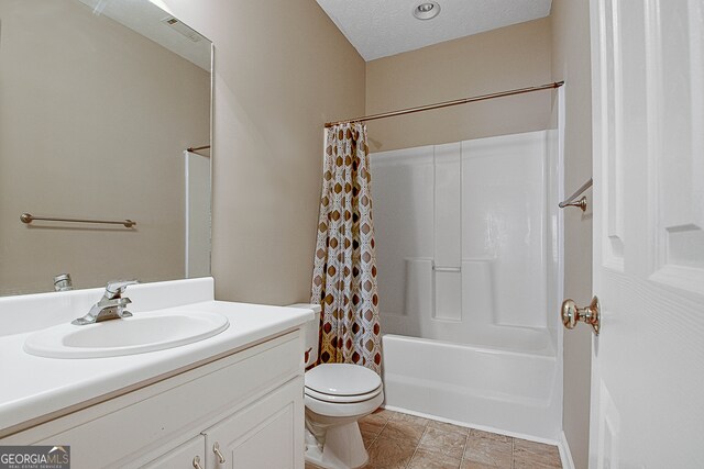 full bathroom featuring a textured ceiling, vanity, toilet, and shower / bath combination with curtain