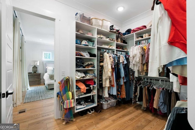 spacious closet featuring hardwood / wood-style flooring