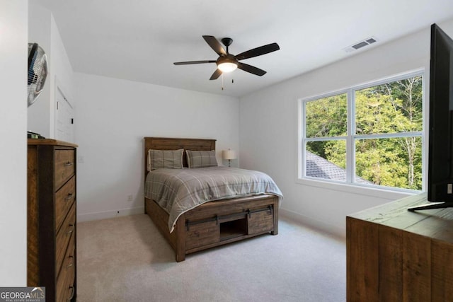 bedroom featuring ceiling fan and light colored carpet