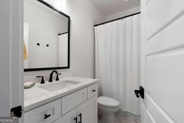 bathroom featuring vanity, toilet, and a shower with shower curtain