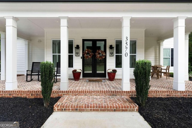 doorway to property with a porch