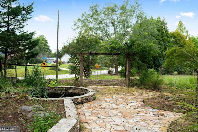 view of property's community with a patio area