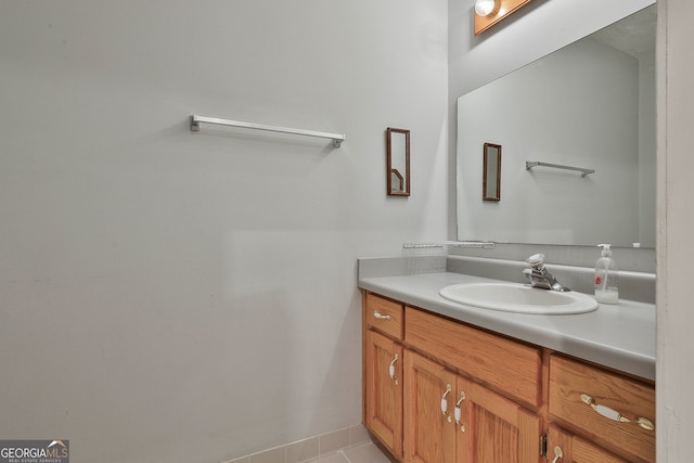 bathroom featuring tile patterned flooring and vanity