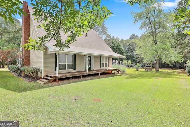 view of home's exterior with a yard and a deck