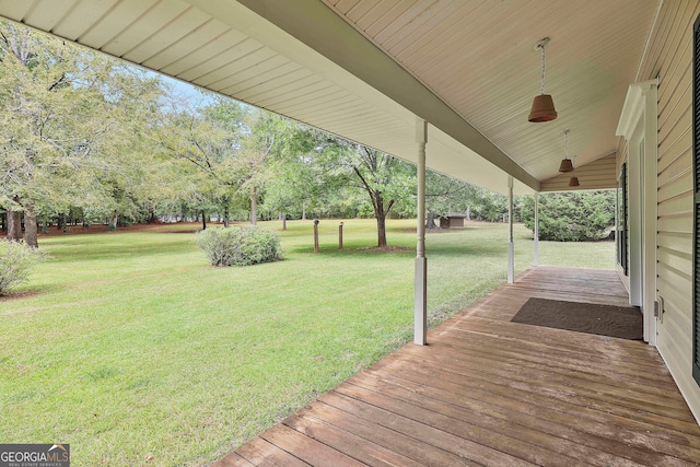 wooden deck with a yard