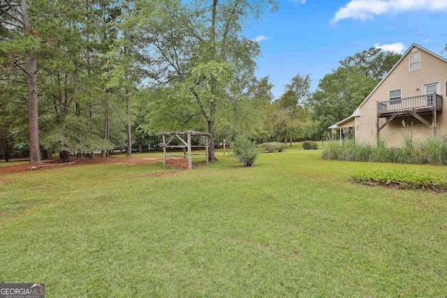 view of yard with a deck