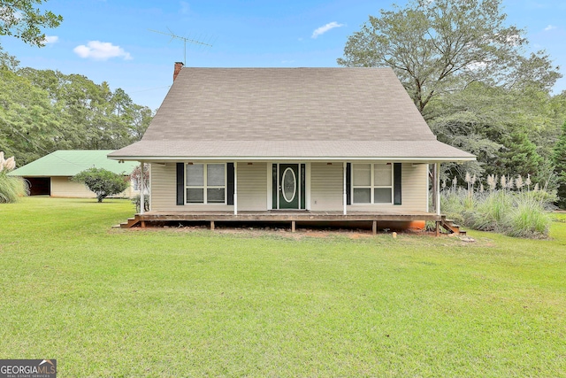 view of front of property with a porch and a front lawn