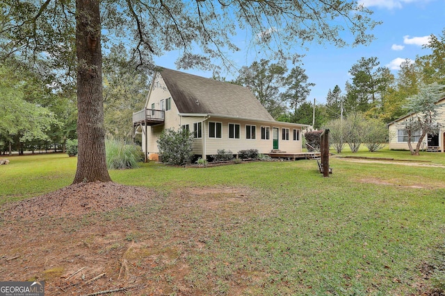 view of side of home featuring a yard