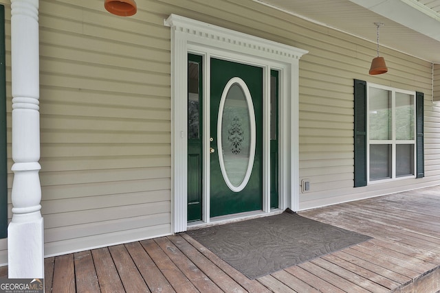 property entrance with a wooden deck