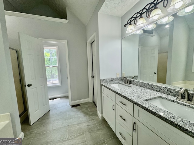 bathroom featuring lofted ceiling, a textured ceiling, vanity, and separate shower and tub