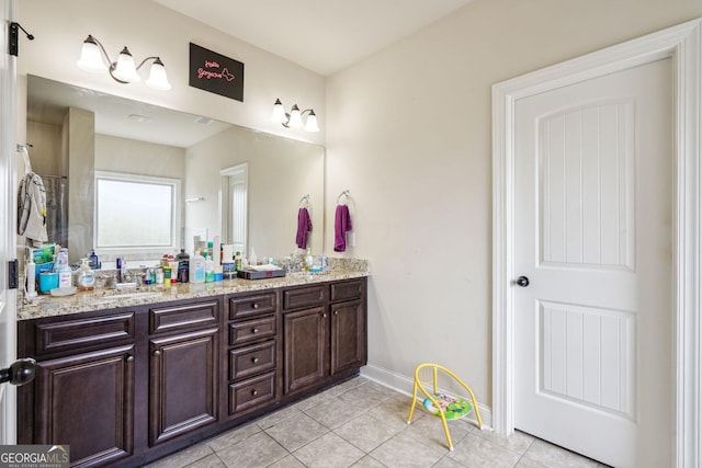 bathroom with vanity and tile patterned floors