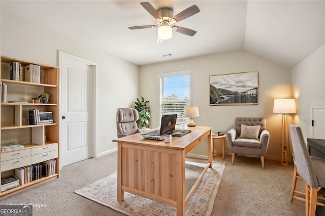 home office with light colored carpet, ceiling fan, and vaulted ceiling