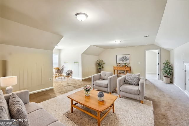 carpeted living room with lofted ceiling