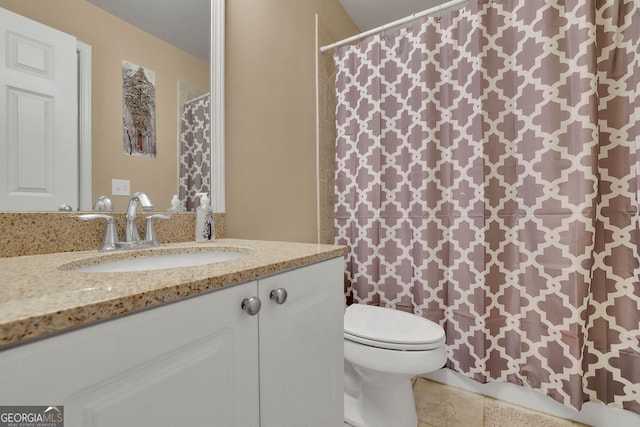 bathroom featuring vanity, toilet, tile patterned floors, and a shower with curtain