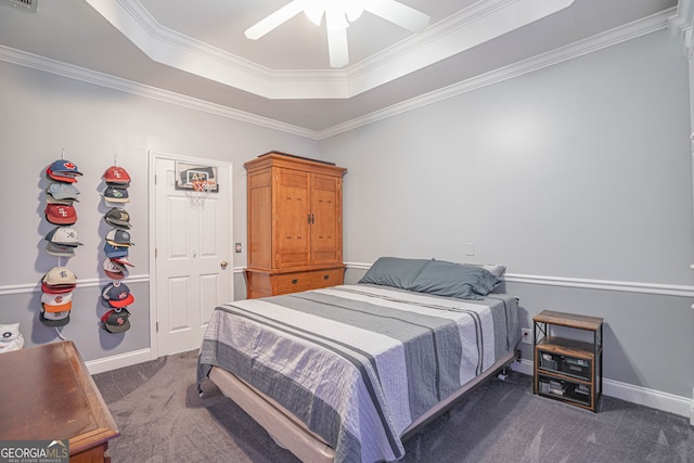 carpeted bedroom with ceiling fan, a raised ceiling, and crown molding